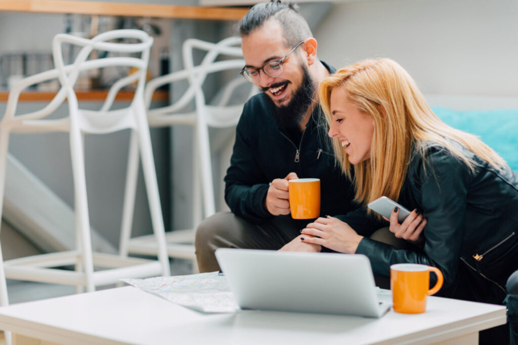 Cheerful young couple searching